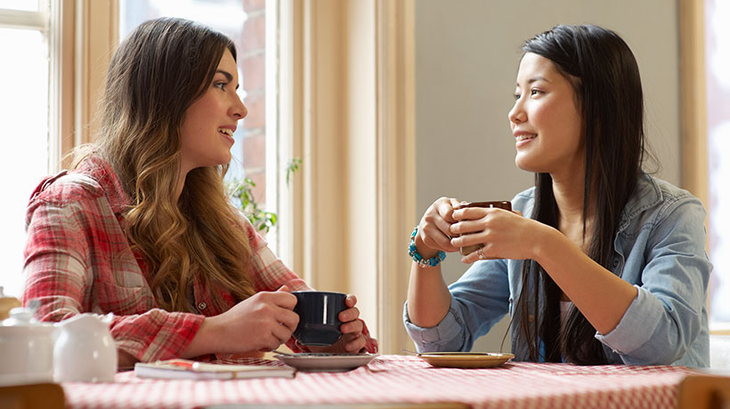 Two women with XLH talking over coffee