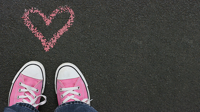 A chalked heart close to the feet of a person with XLH